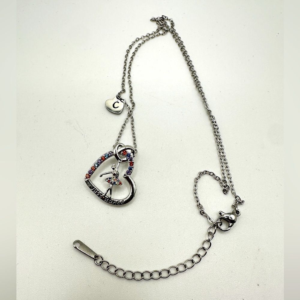 NIB Joycuff "Just dance" silver tone and rhinestone heart with dancer necklace!